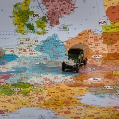 A miniature truck travels across a european map.
